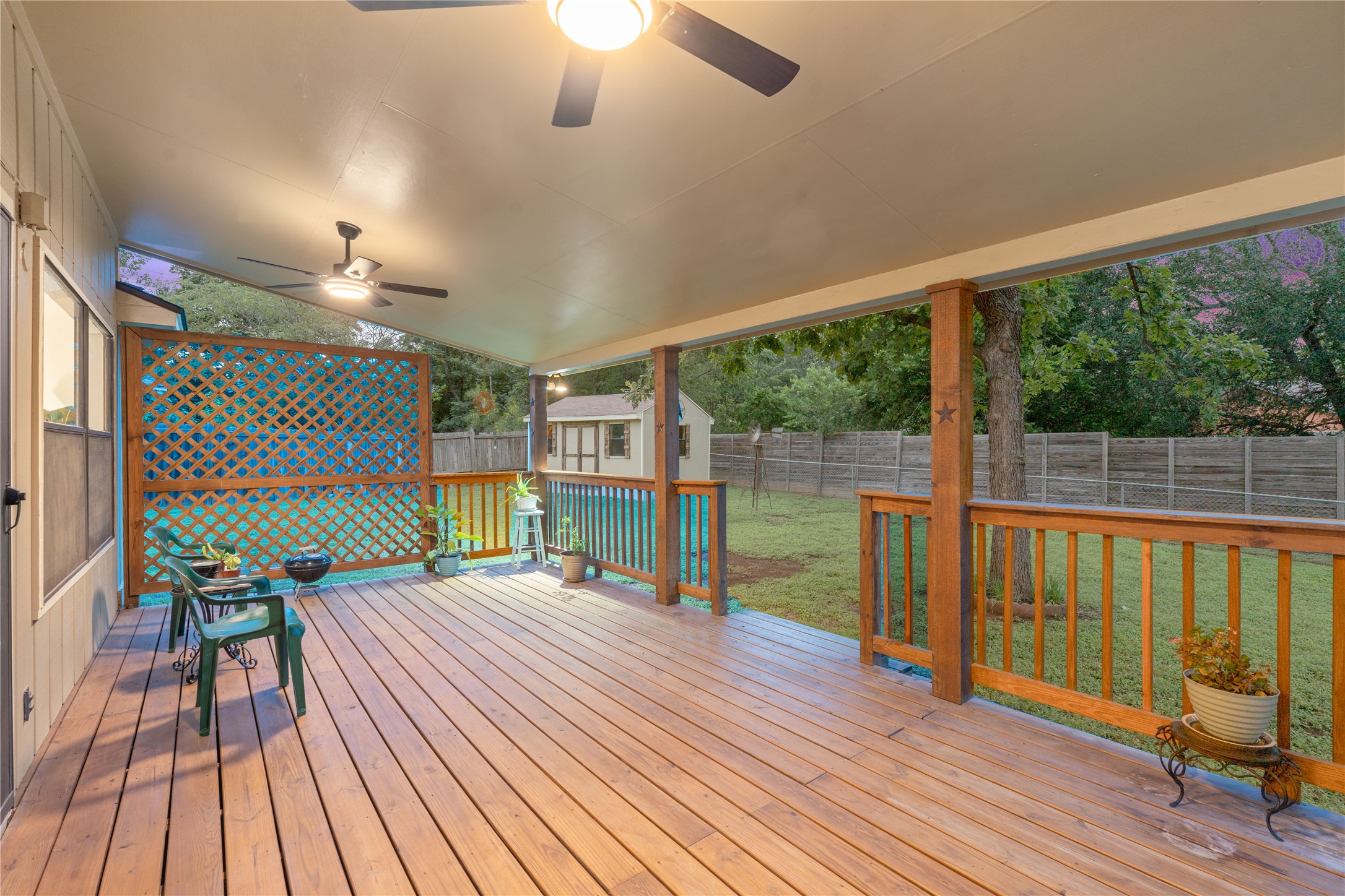 2702 Calabash Cove Austin, TX 78745 - Photo 11 of 40 an empty room with floor to ceiling windows and wooden floor