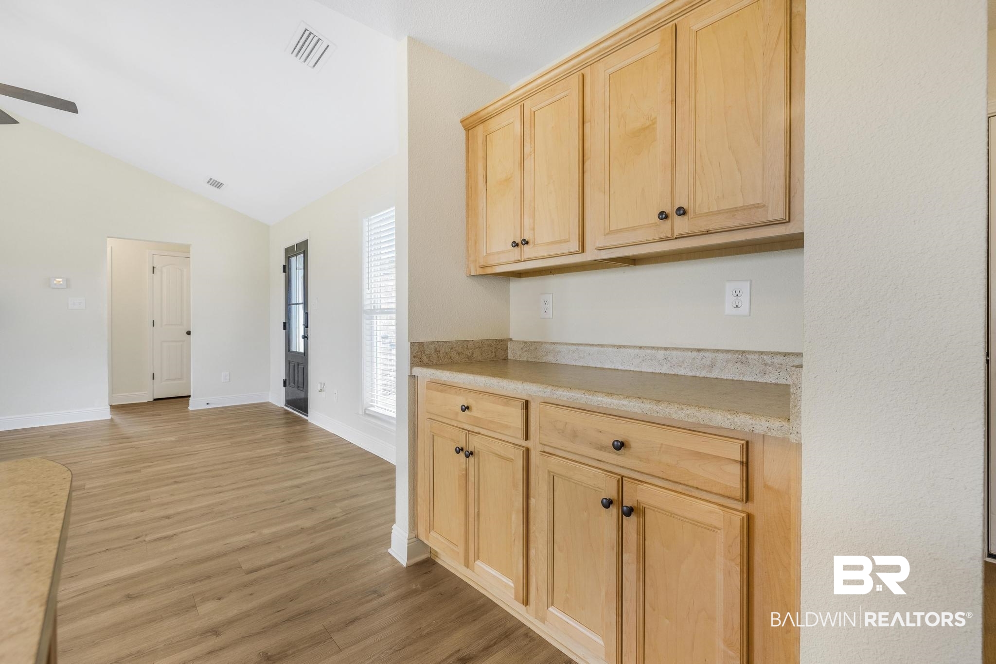21580 Talbot Lane Robertsdale, AL 36567 - Photo 15 of 25 Kitchen featuring light brown cabinets, lofted ceiling, light wood-style floors, and ceiling fan