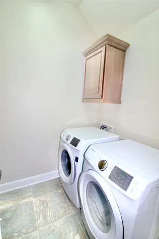 a view of a house with a garden and yard