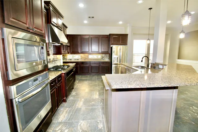 a view of an empty walk in closet with empty room