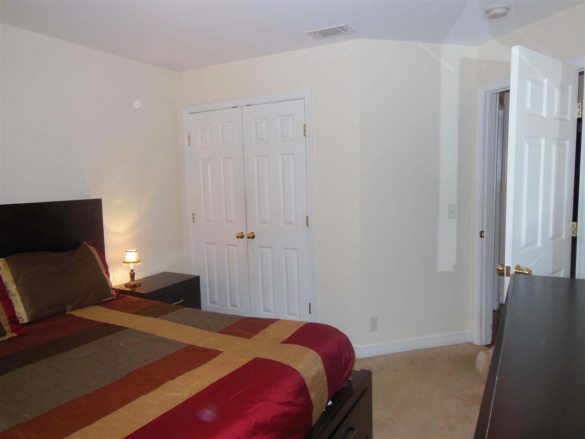 2881 Evergreen Ridge Point Nashville, TN 37217 - Photo 14 of 18 a bedroom with a bed and a dresser