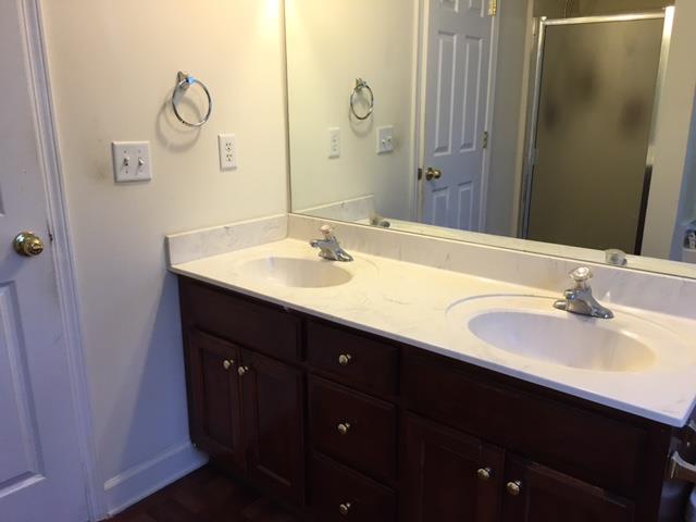 2881 Evergreen Ridge Point Nashville, TN 37217 - Photo 18 of 18 a bathroom with a double vanity sink and a mirror