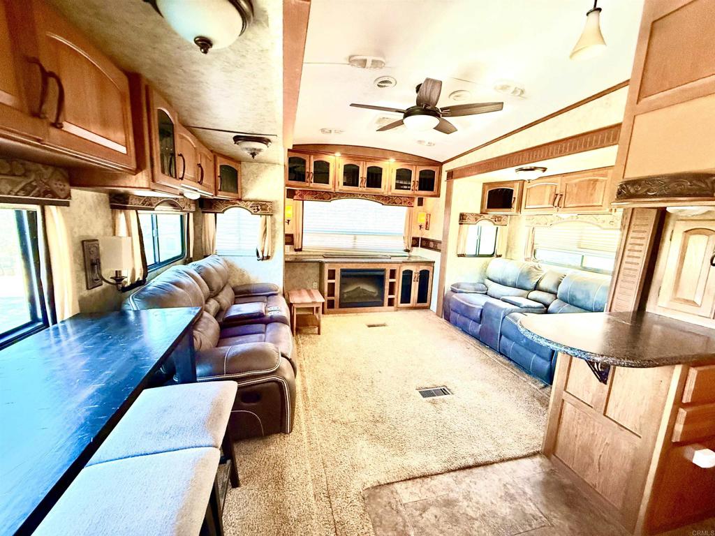 0 Olive Hill Road Fallbrook, CA 92028 - Photo 12 of 40 a living room with furniture and a flat screen tv