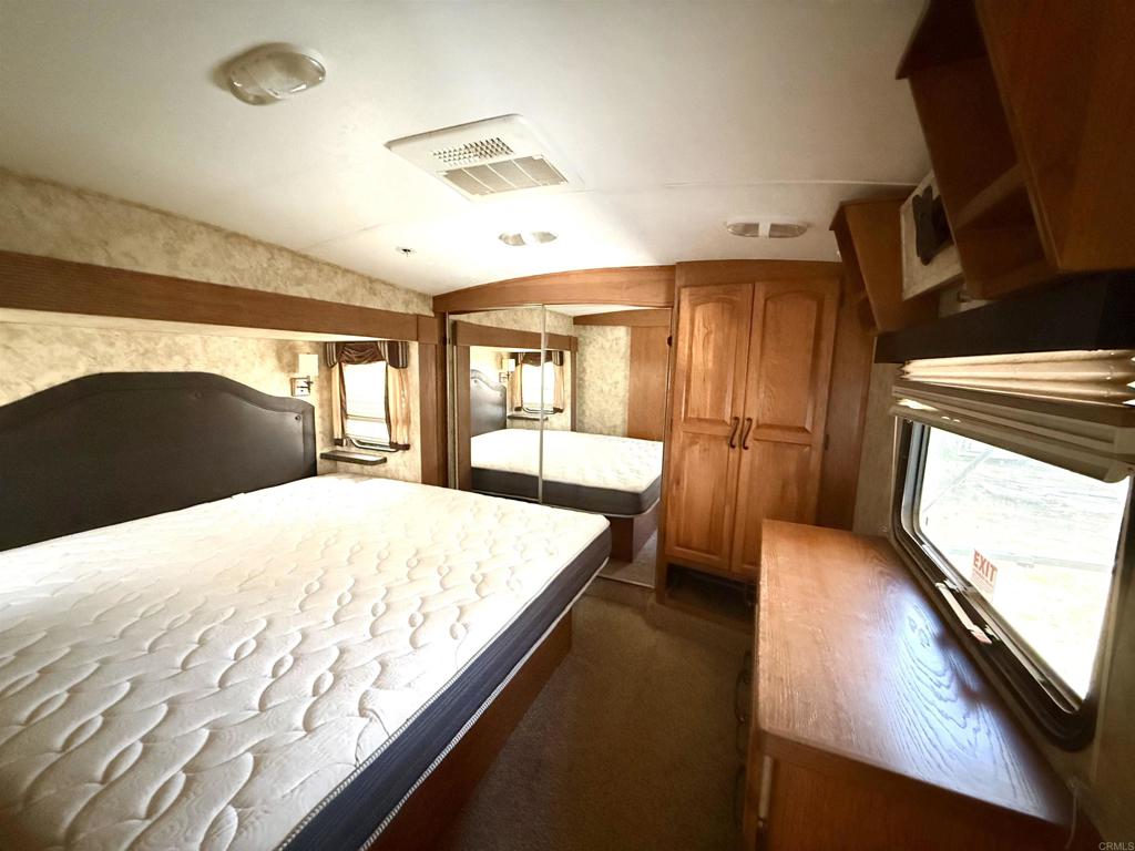 0 Olive Hill Road Fallbrook, CA 92028 - Photo 13 of 40 a bedroom with a bed and wooden floor