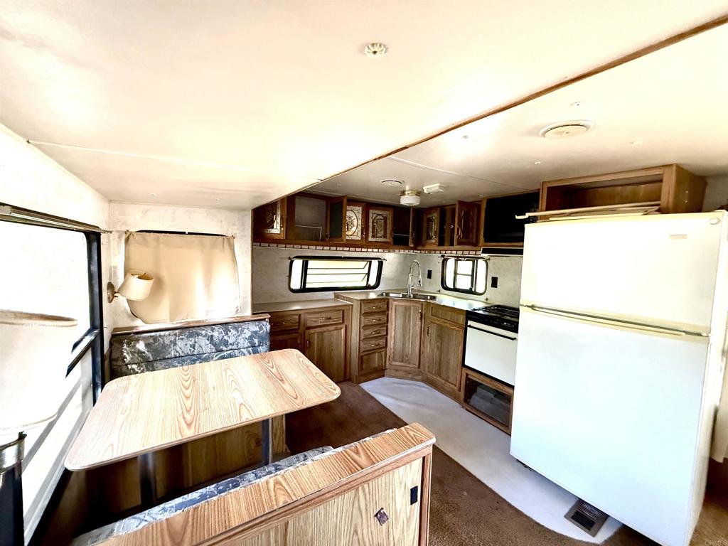 0 Olive Hill Road Fallbrook, CA 92028 - Photo 20 of 40 a kitchen with a refrigerator and a stove