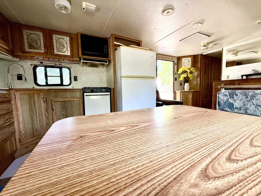 0 Olive Hill Road Fallbrook, CA 92028 - Photo 22 of 40 a bedroom with a bed dresser and a flat tv screen
