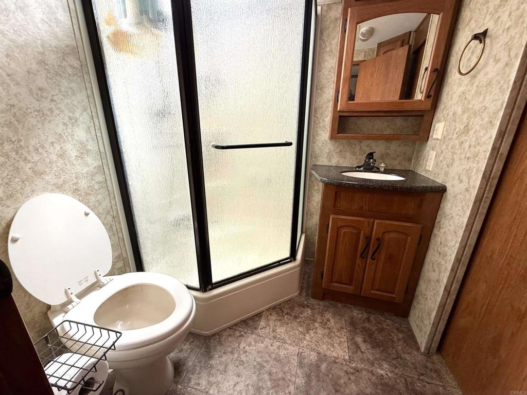 0 Olive Hill Road Fallbrook, CA 92028 - Photo 24 of 40 a bathroom with a granite countertop sink and a mirror