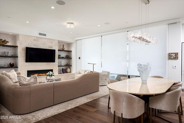 a living room with furniture fireplace and a flat screen tv