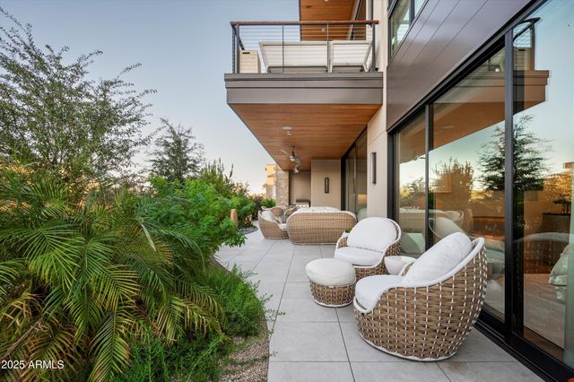 a living room with dining table and chairs
