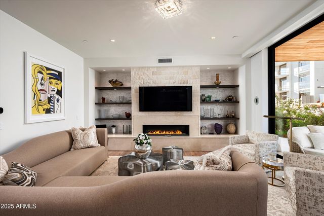 a view of a living room and dining room with furniture