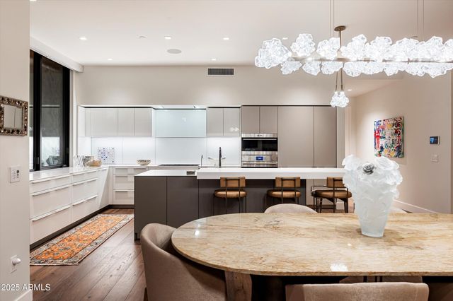 a bathroom with a double vanity sink toilet and shower