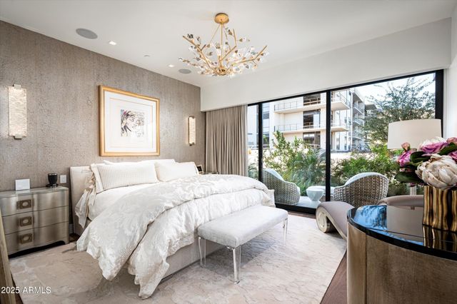 a view of a patio with table and chairs and potted plants