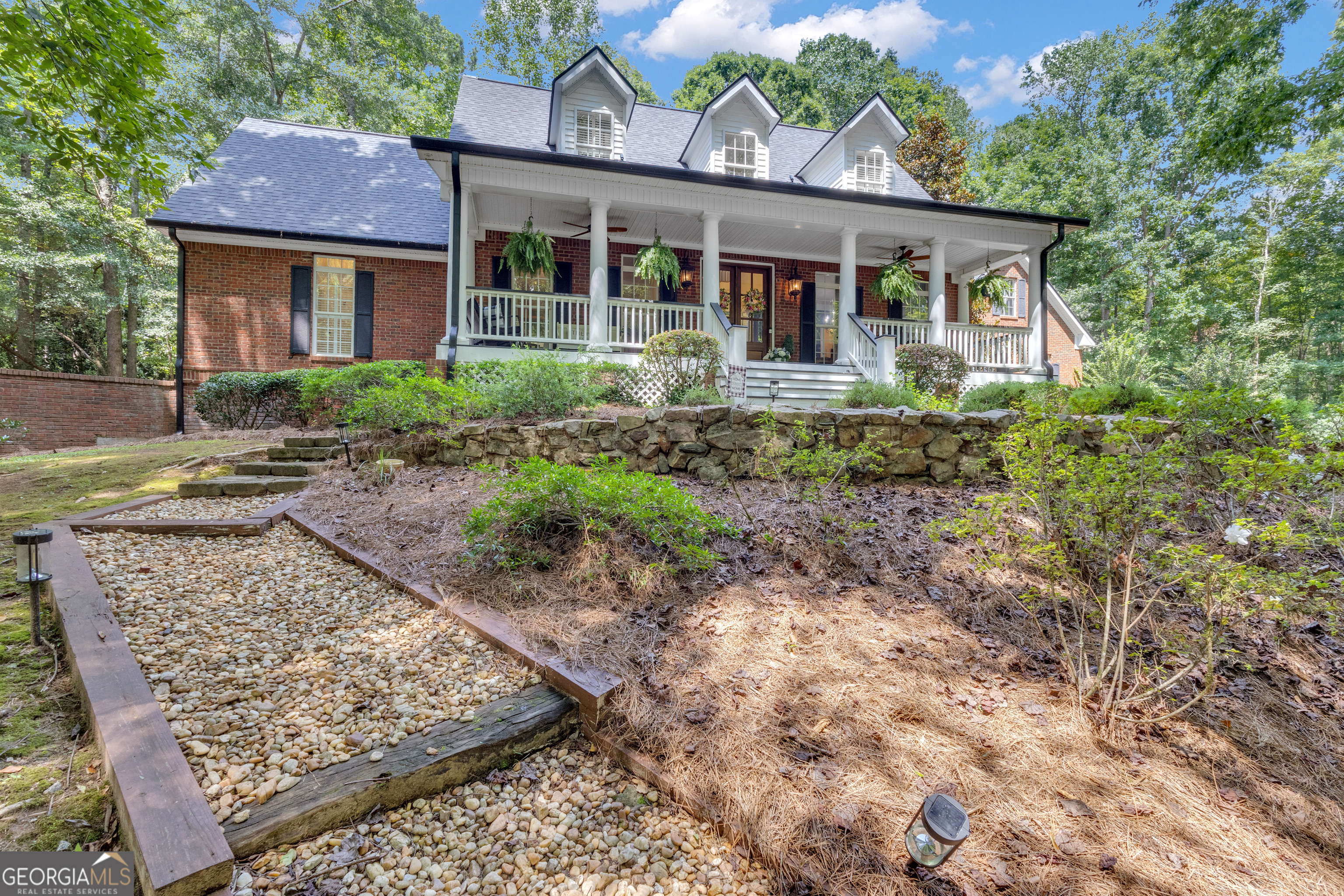 a front view of a house with garden