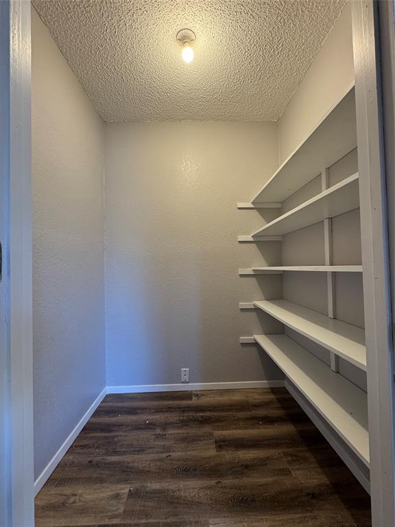 205 Wight Street Roxton, TX 75477 - Photo 18 of 22 a view of room with wooden floor and a window