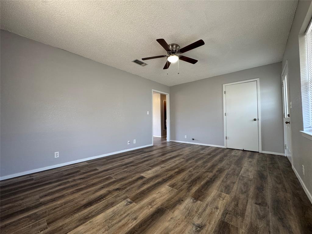 205 Wight Street Roxton, TX 75477 - Photo 4 of 22 a view of an empty room and wooden floor