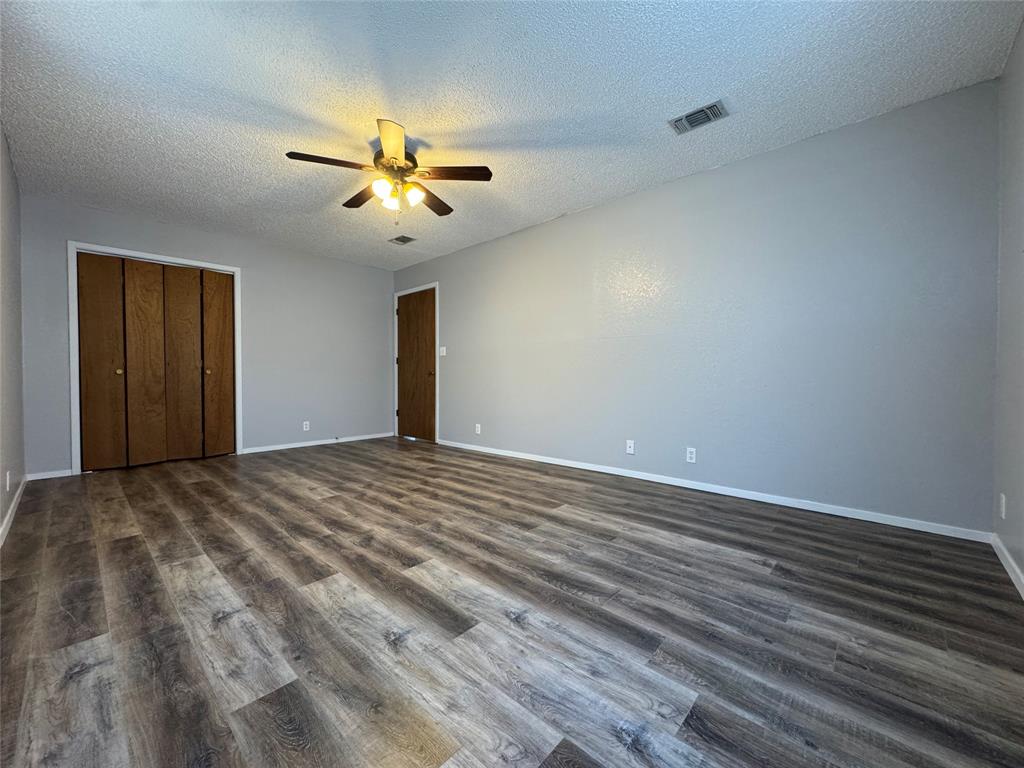 205 Wight Street Roxton, TX 75477 - Photo 6 of 22 a view of a livingroom with a ceiling fan and window