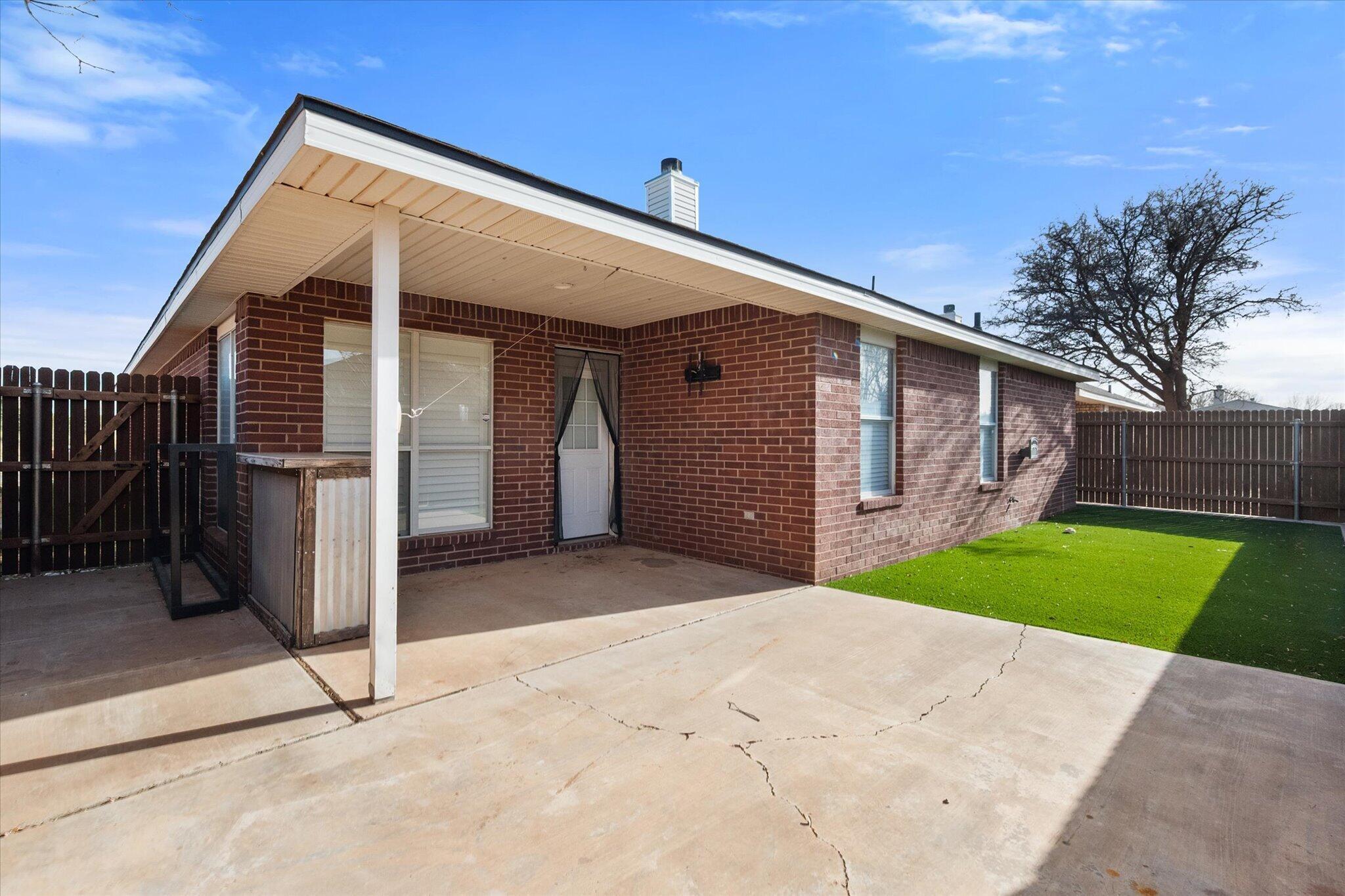6104 Duke Street Lubbock, TX 79416 - Photo 27 of 28 a view of backyard of house