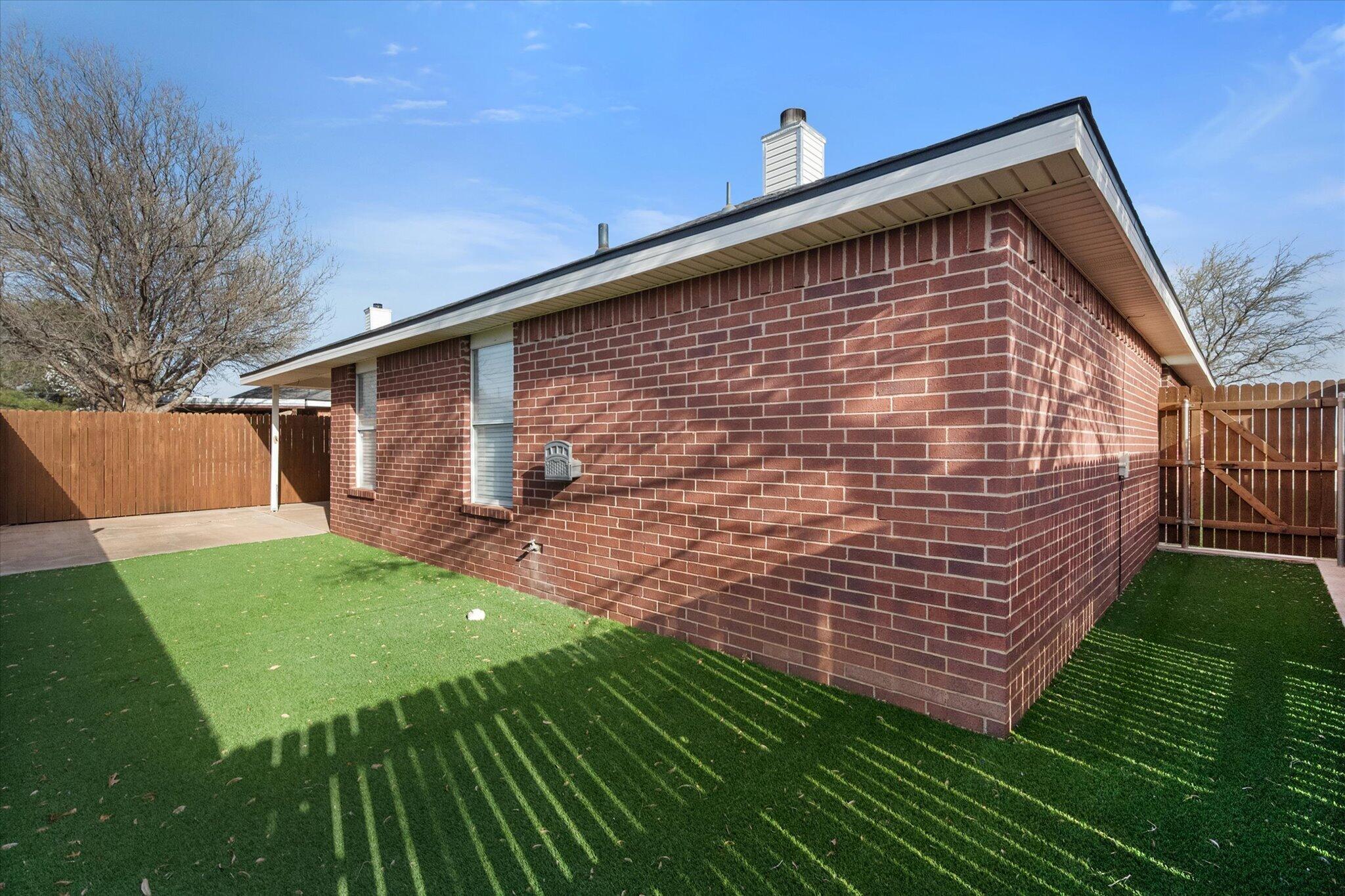 6104 Duke Street Lubbock, TX 79416 - Photo 28 of 28 a backyard of a house with seating space