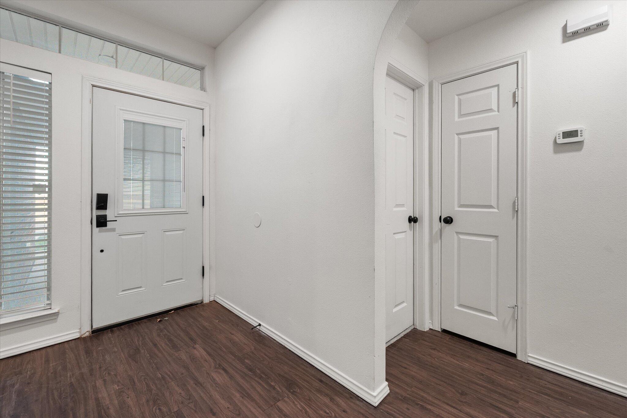 6104 Duke Street Lubbock, TX 79416 - Photo 4 of 28 a view of an empty room with wooden floor