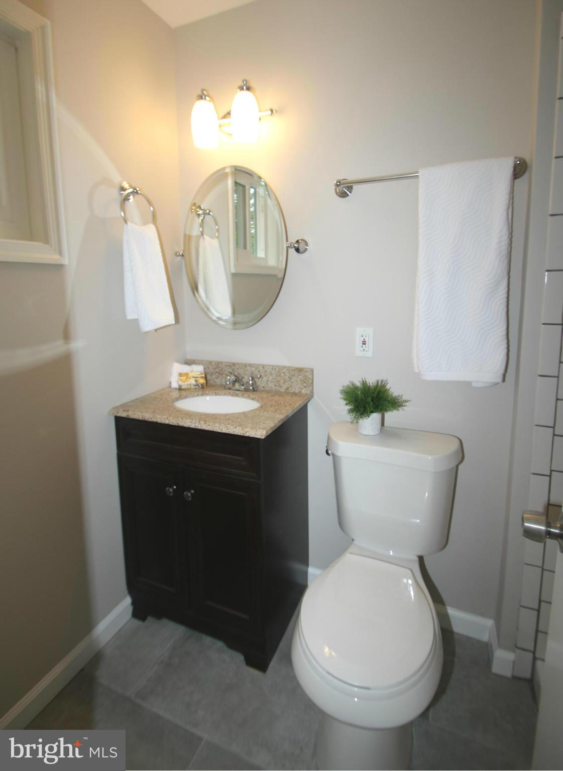 3405 Briars Road Brookeville, MD 20833 - Photo 12 of 21 a bathroom with a toilet sink and mirror