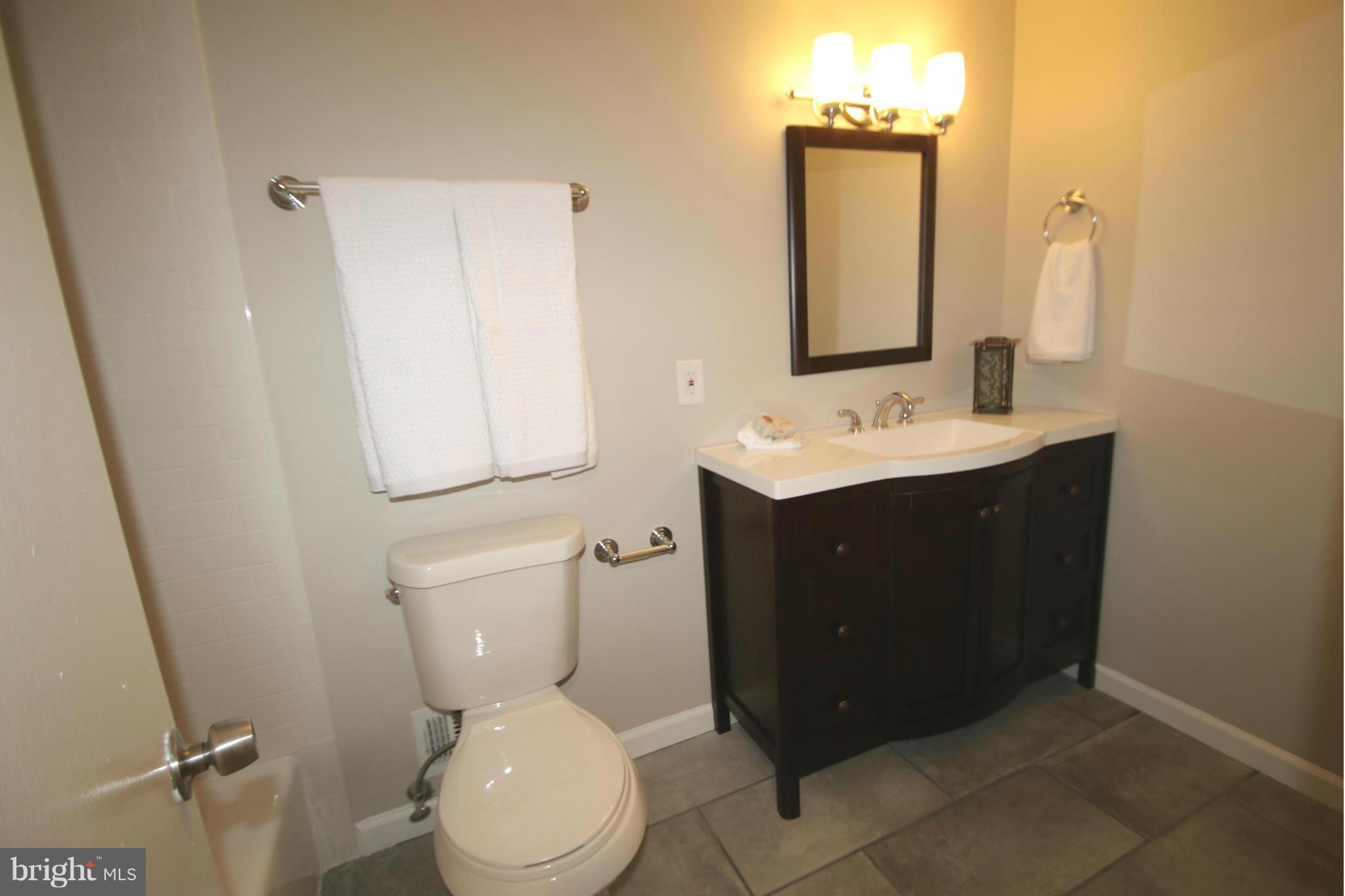 3405 Briars Road Brookeville, MD 20833 - Photo 14 of 21 a bathroom with a toilet sink and mirror