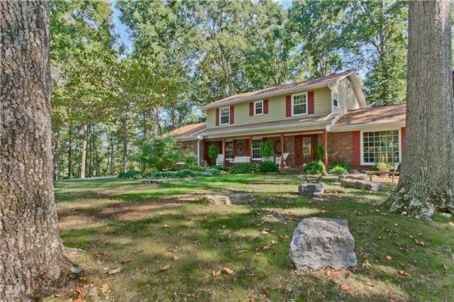 5247 Old Harding Road Fairview, TN 37062 - Photo 1 of 20 a front view of a house with a yard