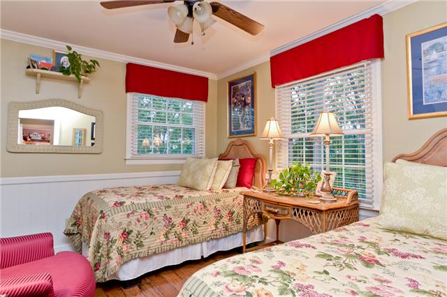 5247 Old Harding Road Fairview, TN 37062 - Photo 16 of 20 a bedroom with bed and windows