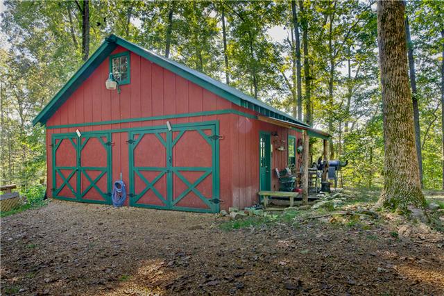 5247 Old Harding Road Fairview, TN 37062 - Photo 17 of 20 a view of wooden house with large trees