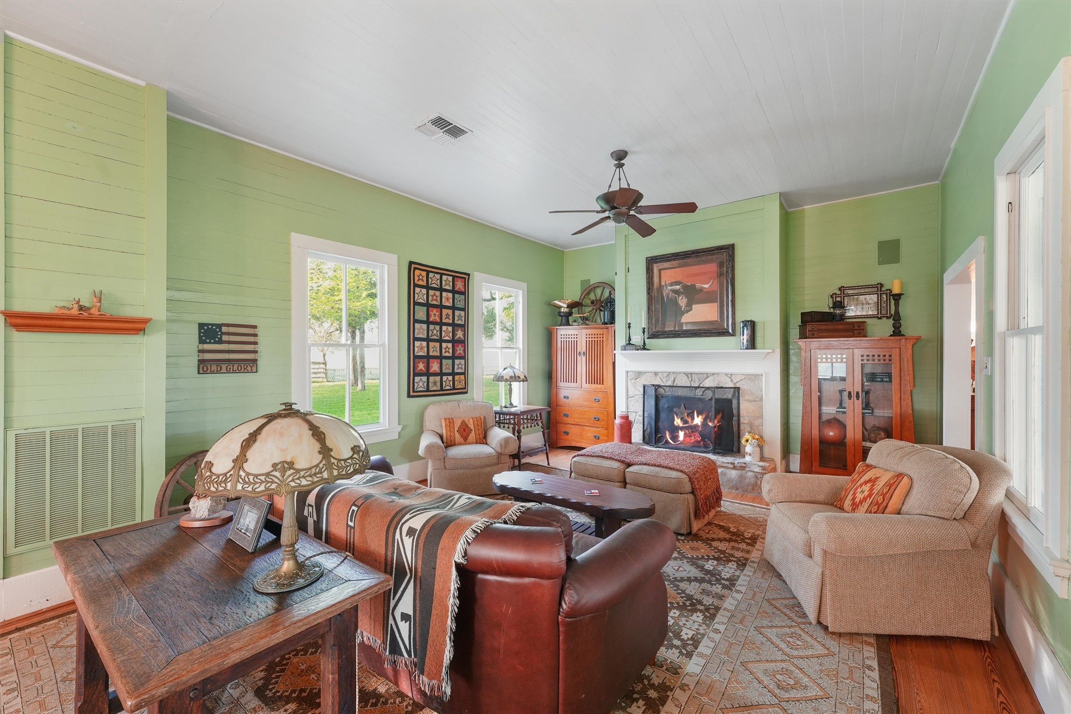 9058 Sam Houston Road Brenham, TX 77833 - Photo 11 of 50 a living room with fireplace furniture and a large window