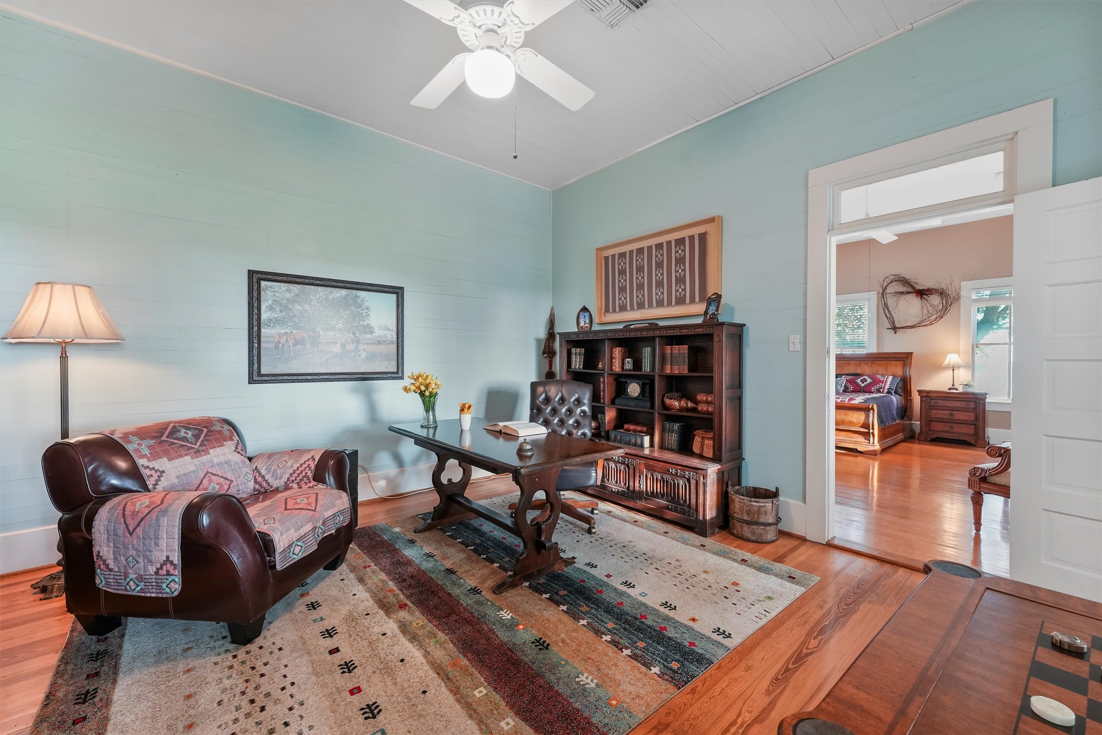 9058 Sam Houston Road Brenham, TX 77833 - Photo 18 of 50 a living room with furniture and a wooden floor