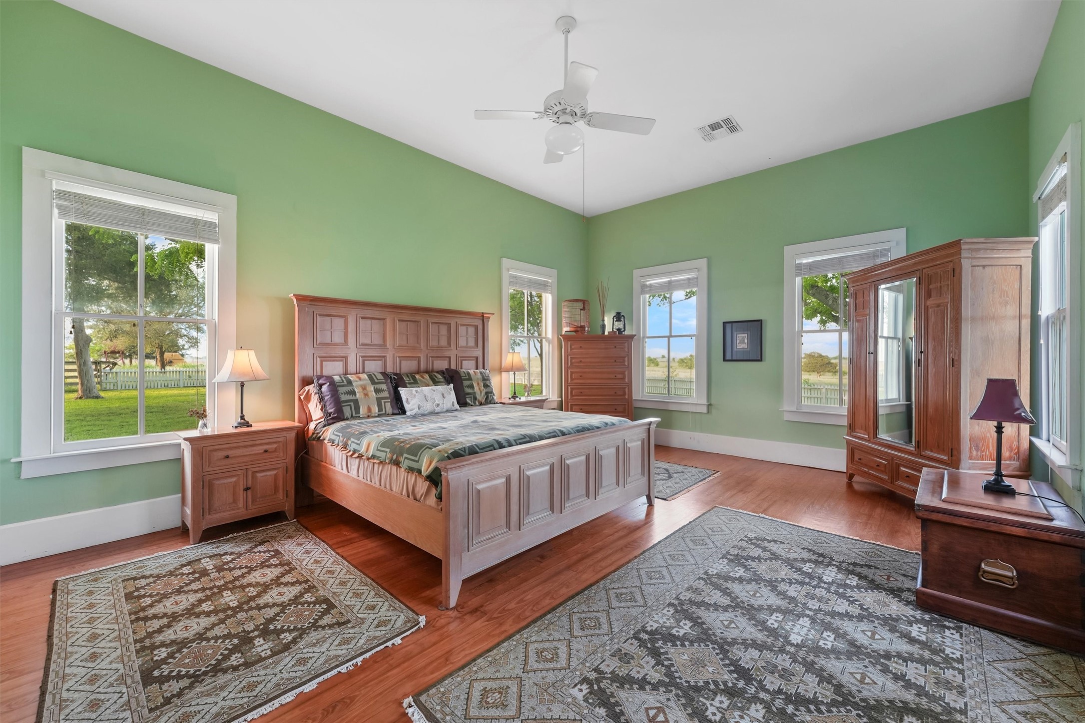 9058 Sam Houston Road Brenham, TX 77833 - Photo 21 of 50 a bedroom with a bed wooden floor and window