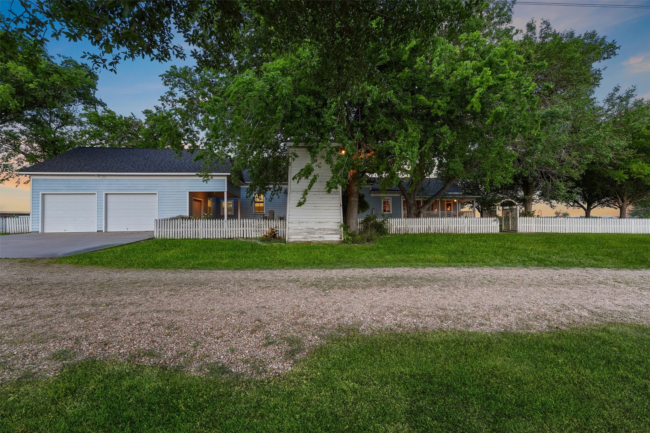 9058 Sam Houston Road Brenham, TX 77833 - Photo 25 of 50 a house with huge green field in front of it