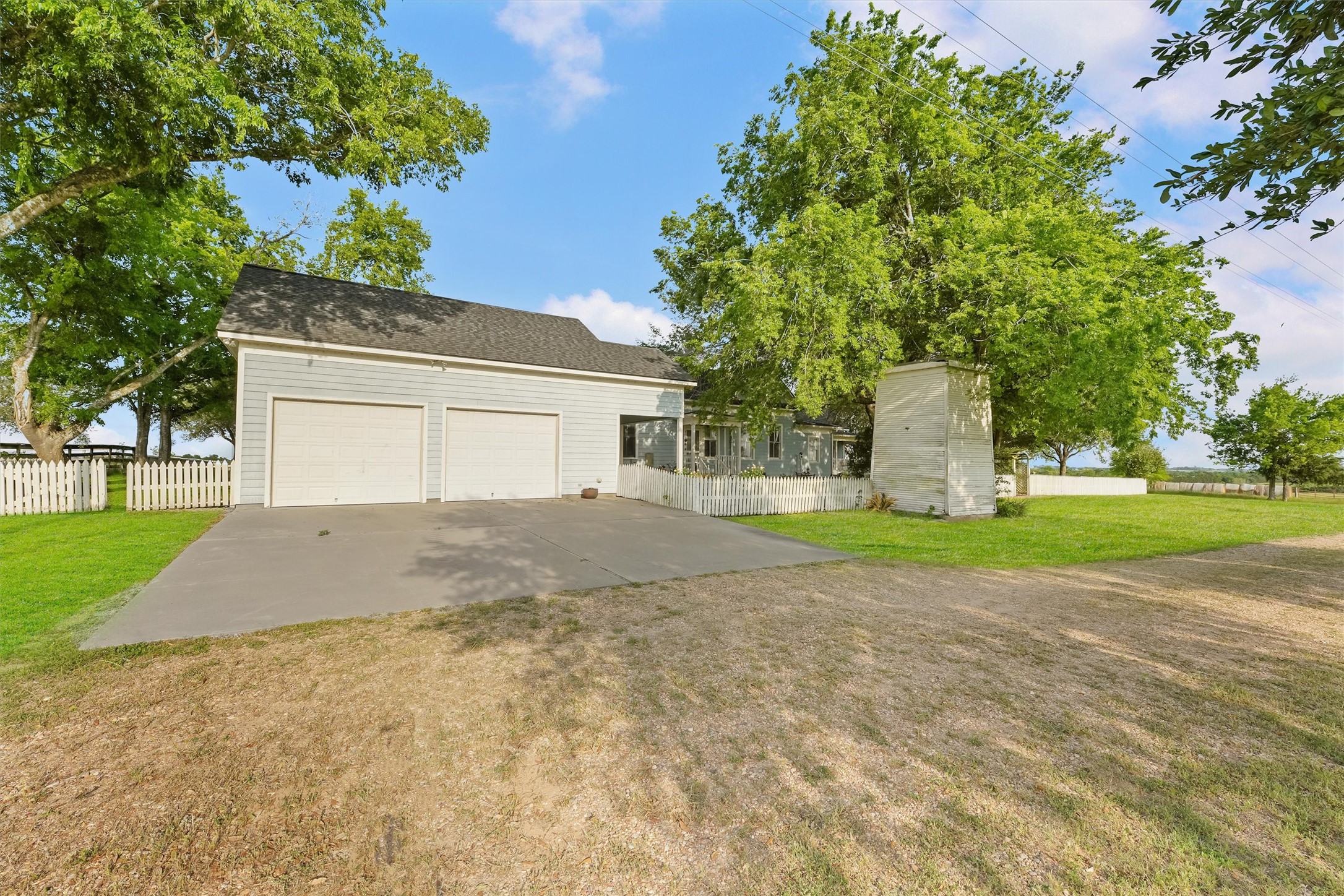 9058 Sam Houston Road Brenham, TX 77833 - Photo 10 of 50 a house with trees in front of it