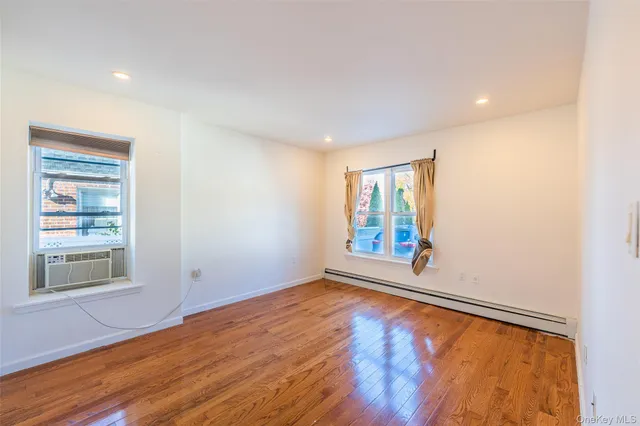 a bedroom with a balcony a bed and a flat screen television