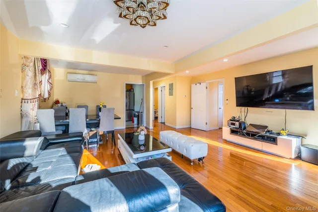 a kitchen with stainless steel appliances granite countertop a refrigerator a stove and a refrigerator