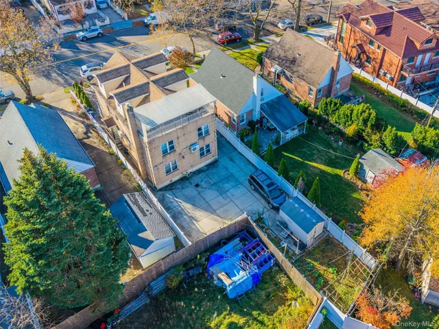 an aerial view of a house with a garden and plants