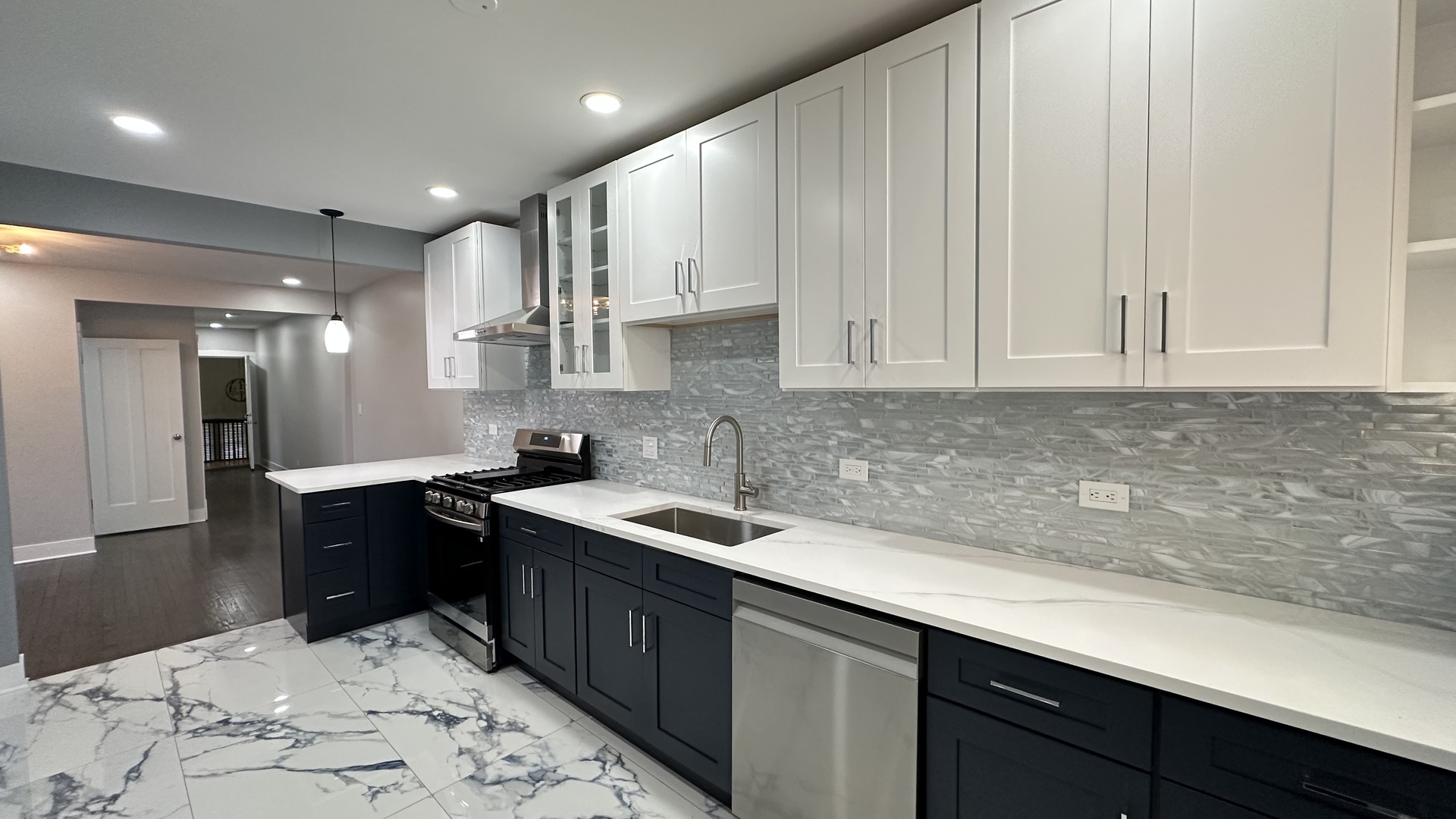 5226 North Bernard Street, Unit 2 Chicago, IL 60625 - Photo 11 of 12 a kitchen with a sink and cabinets