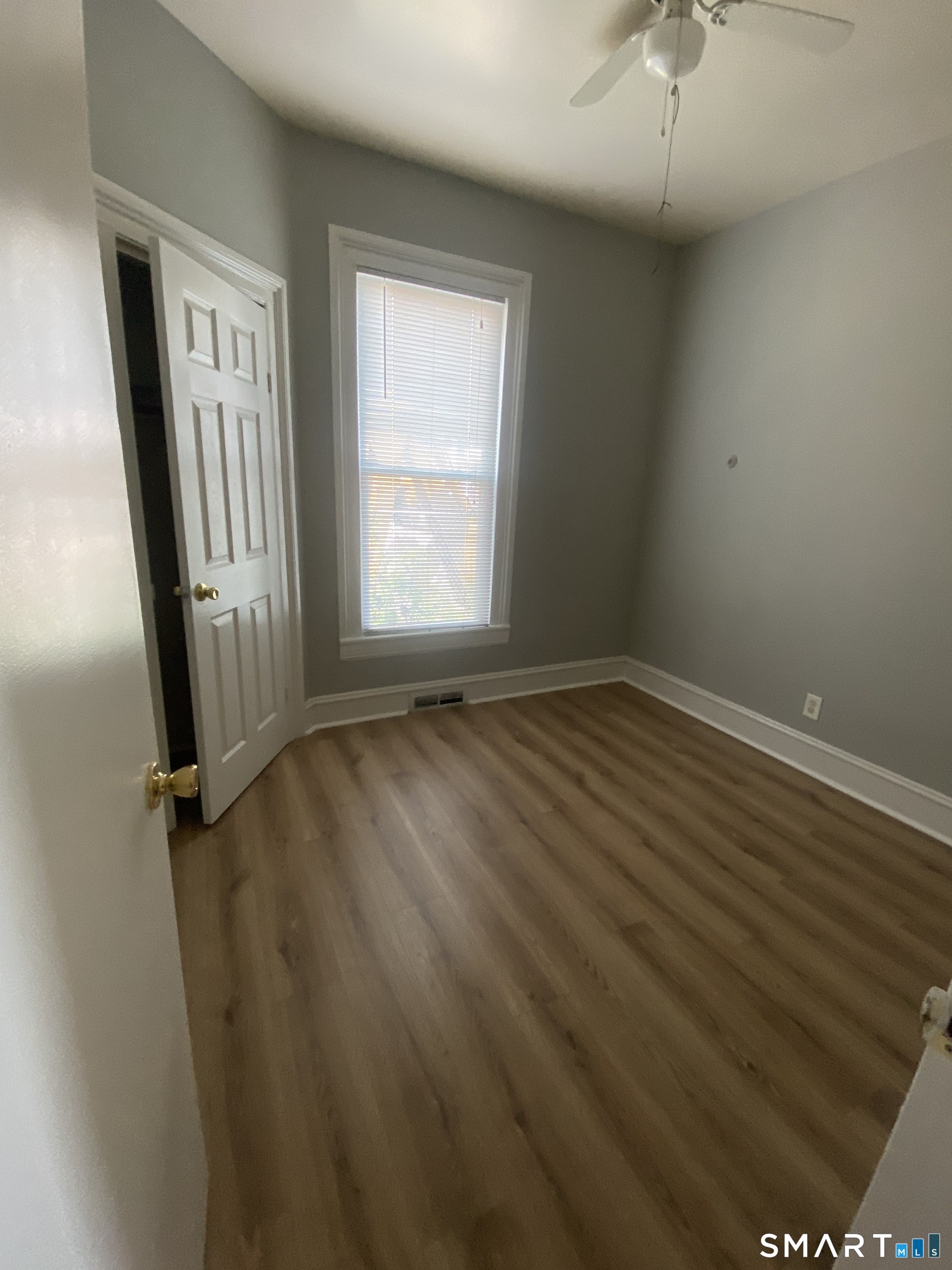 432 East Main Street, Unit 438 Bridgeport, CT 06608 - Photo 2 of 8 an empty room with wooden floor and windows