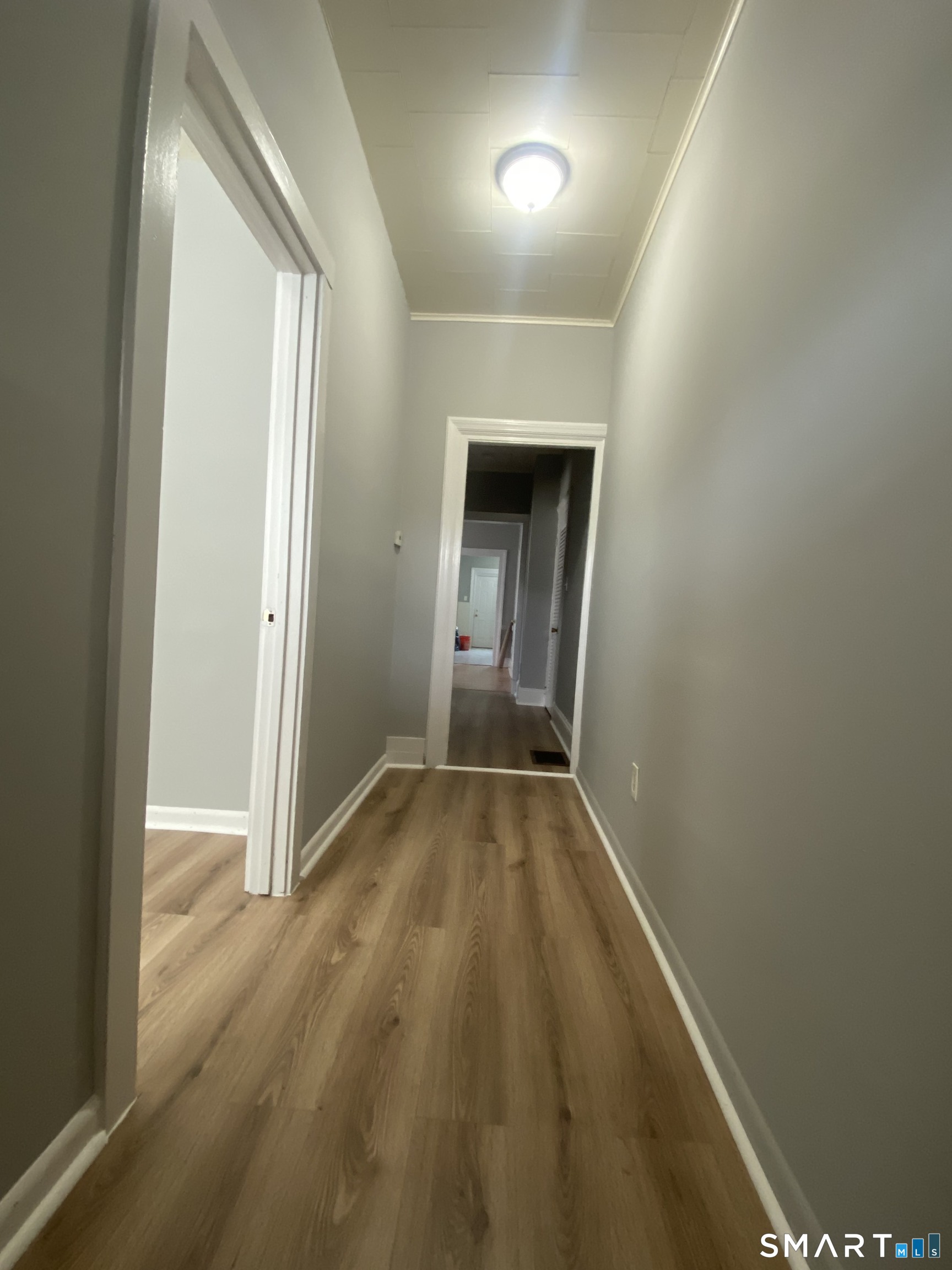 432 East Main Street, Unit 438 Bridgeport, CT 06608 - Photo 7 of 8 a view of hallway with wooden floor