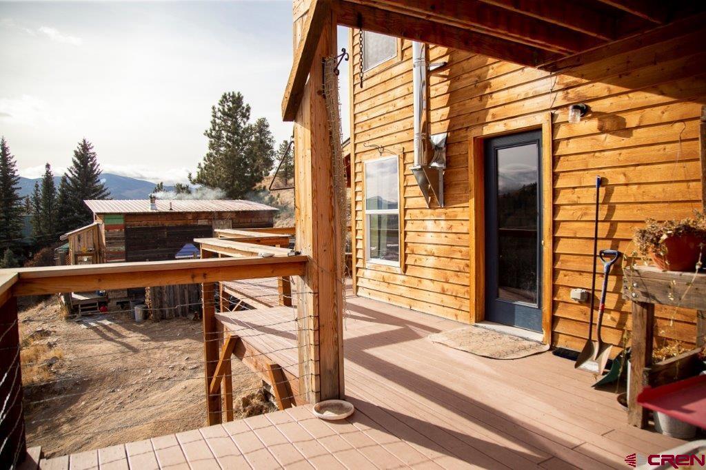 301 West 3rd Street Creede, CO 81130 - Photo 16 of 17 a view of balcony with two chairs and wooden floor