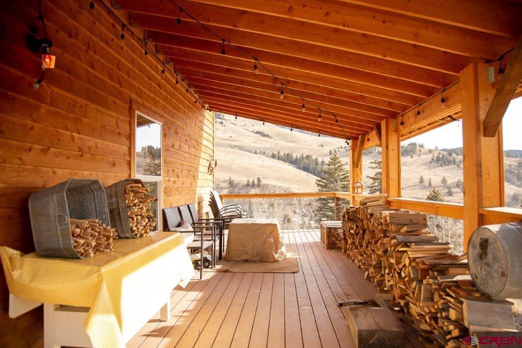 301 West 3rd Street Creede, CO 81130 - Photo 17 of 17 a view of a balcony with wooden floor