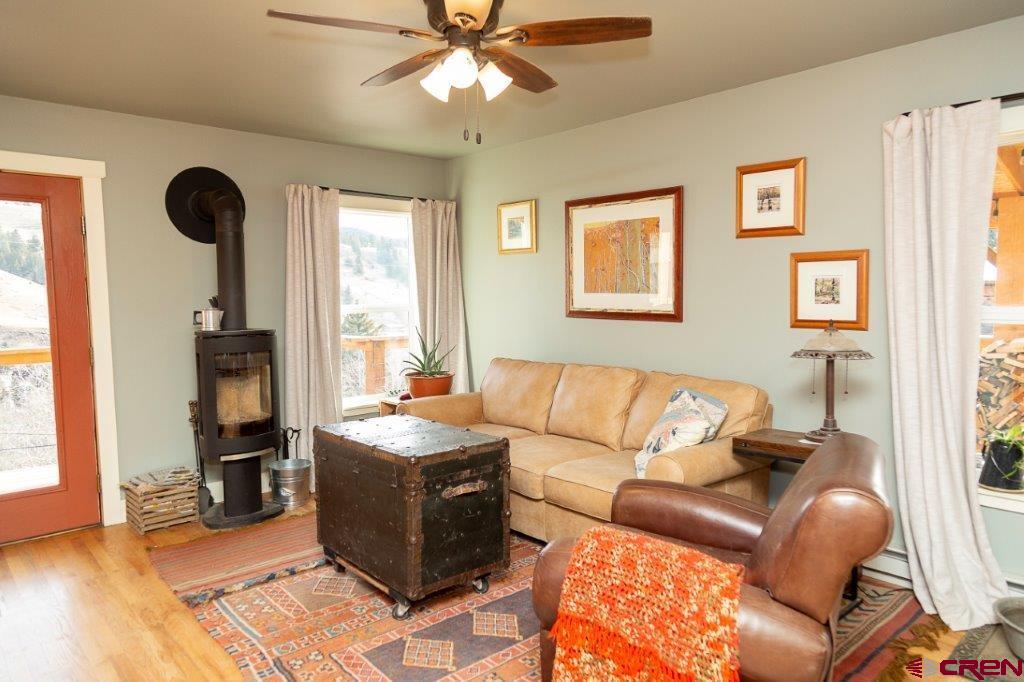 301 West 3rd Street Creede, CO 81130 - Photo 5 of 17 a living room with furniture and a window