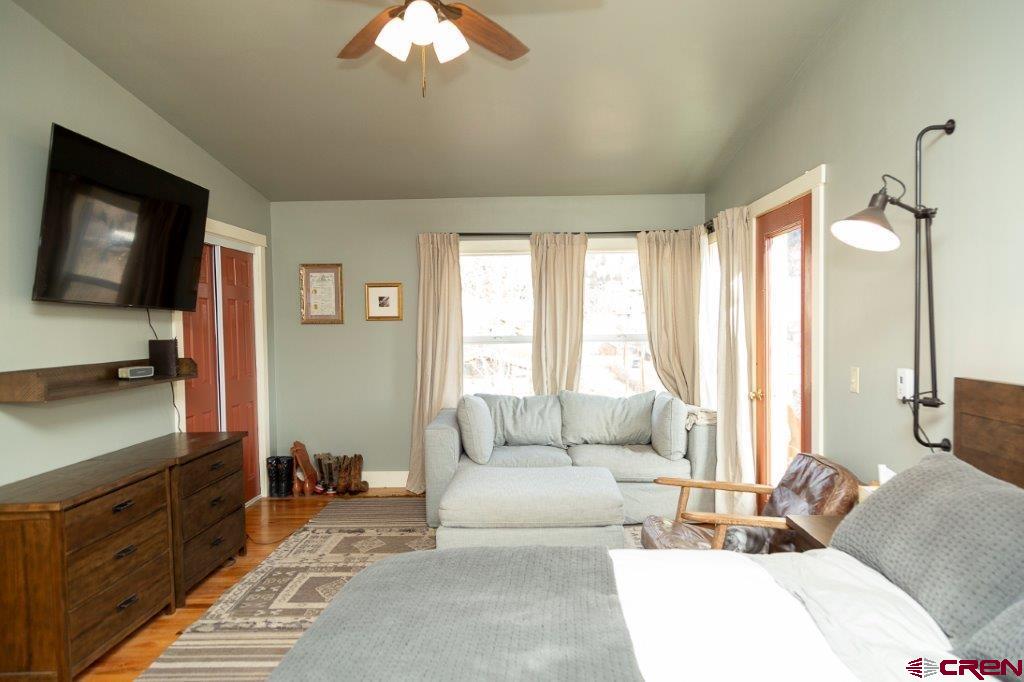 301 West 3rd Street Creede, CO 81130 - Photo 9 of 17 a living room with furniture and a flat screen tv