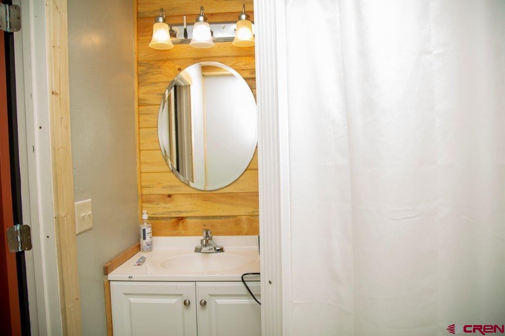 301 West 3rd Street Creede, CO 81130 - Photo 10 of 17 a bathroom with a sink and a mirror