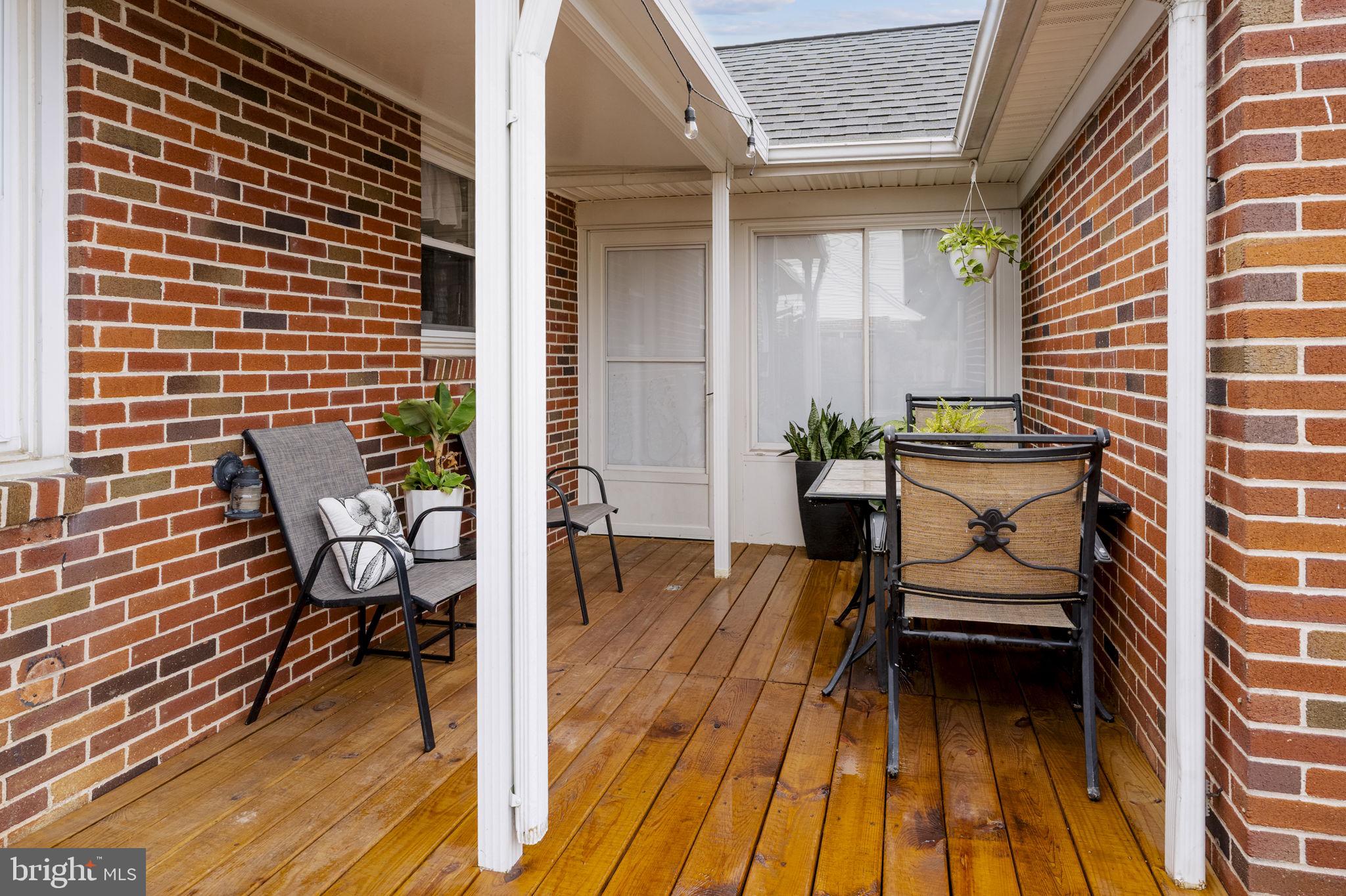 210 Musser Road East Earl, PA 17519 - Photo 11 of 44 a view of a patio with a dining table and chairs