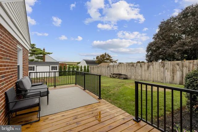 a balcony with view of trees in front of it