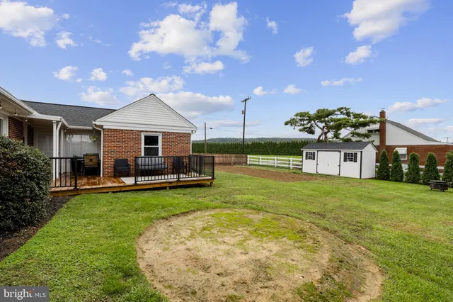 a view of a house with a yard porch and sitting area