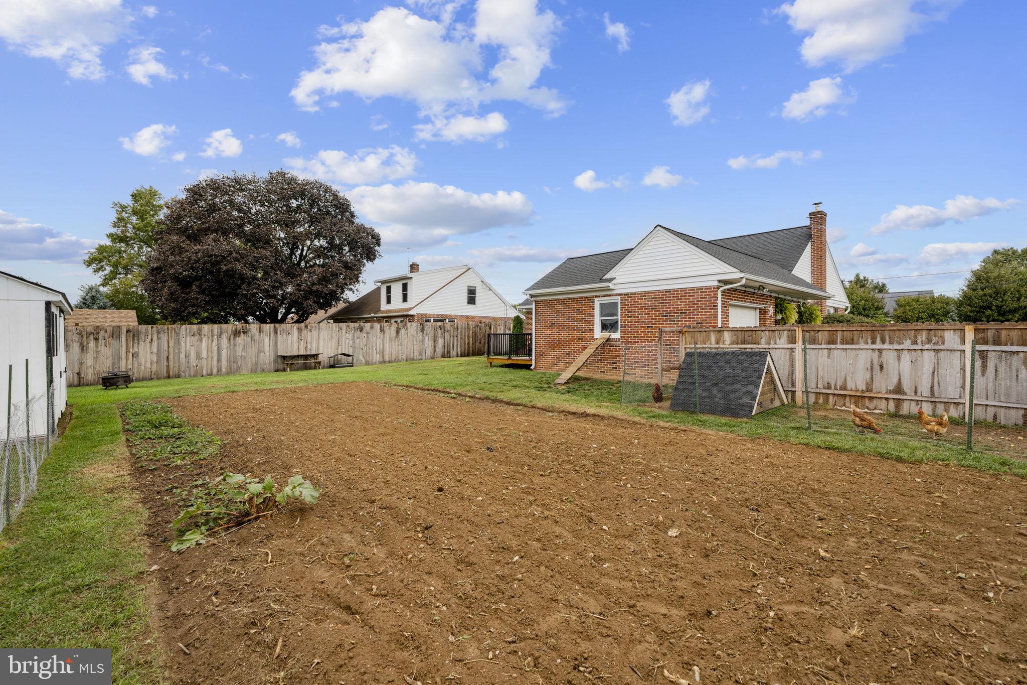 210 Musser Road East Earl, PA 17519 - Photo 16 of 44 a front view of a house with a yard and garage