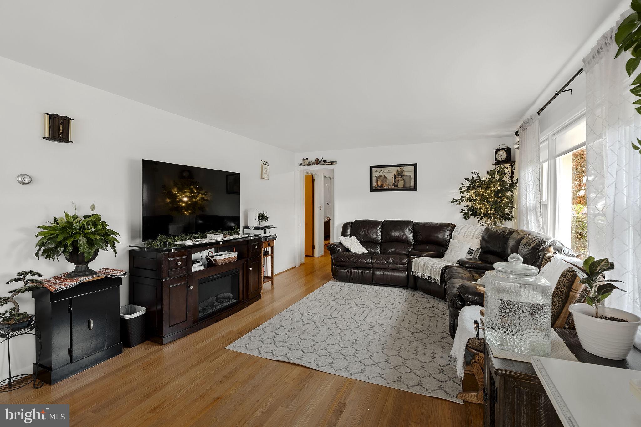 210 Musser Road East Earl, PA 17519 - Photo 17 of 44 a living room with furniture and a flat screen tv