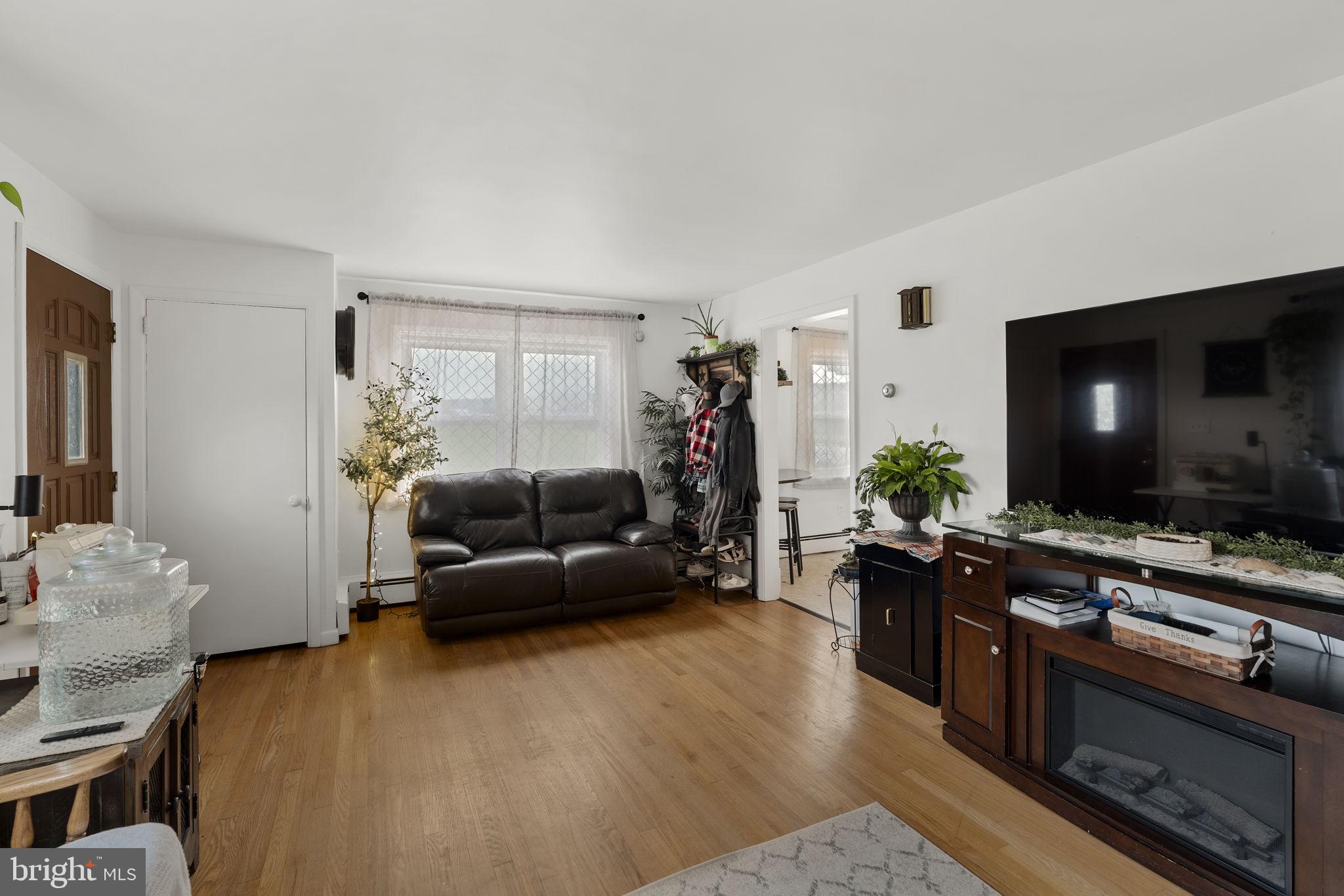 210 Musser Road East Earl, PA 17519 - Photo 19 of 44 a living room with furniture and a flat screen tv